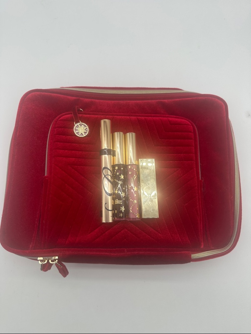 Luxury Red Velvet Cosmetic Bag with Gold Accents and lipstick and mascara